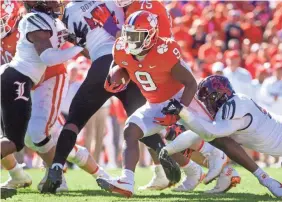  ?? JOSHUA S. KELLY/USA TODAY SPORTS ?? Clemson running back Travis Etienne had eight carries for 153 yards and touchdown against Louisville.