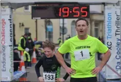  ??  ?? Josh Muckian and Peter Fitzpatric­k finish Fitzer’s 5K.