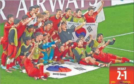  ?? REUTERS ?? South Korea players celebrate after beating Portugal to enter the last-16 stage of the World Cup on Friday.