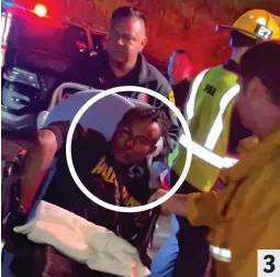  ?? ?? Suspect: Isaiah Lee is taken to an ambulance by medics 3