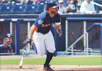  ?? JASEN VINLOVE / USA TODAY SPORTS ?? Houston Astros’ Jose Altuve heads to first base after getting a hit against the New York Mets during their spring training game in Palm Beaches, Florida, on Monday — hours after signing a seven-year contract worth $163.5 million.