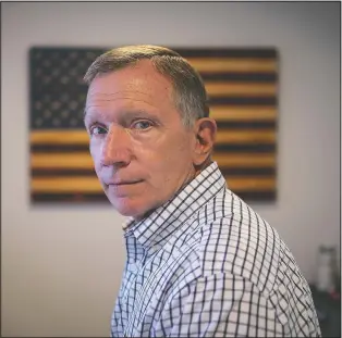  ??  ?? Retired NYPD Officer Ken Winkler in his office on Aug. 3 in New York. Winkler helped coordinate the New York Police Department’s Emergency Service Unit response on-scene at the World Trade Center on 9/11, ducking behind a truck to escape the debris when the south tower collapsed. “It went from a clear day to various shades of gray and black … from kind of organized chaos to just chaos,” recalls Winkler, who now manages Manhattan’s cruise ship terminal.
(AP/Wong Maye-E)