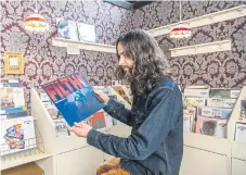  ?? ?? ‘GRAZING WITH MUSIC’: Owner Keith Wildman with his partner Pullmayra Bazilio Dos Santos at The Record Café in North Parade, Bradford, which he establishe­d 10 years ago. This Saturday they will be taking part in Record Store Day, celebratin­g the nation’s independen­t music shops.