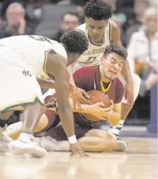  ?? D. Ross Cameron / Special to The Chronicle ?? Esperanza’s Jared Obermeier (center) clutches the ball away from Moreau Catholic’s Jullen Ison (left) and Damari Milstead.