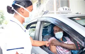  ?? Ronald Kumar ?? Taxi driver, Mohammad Janif, 64, receiving a booster shot from nurse Adi Aseri Qoro at Albert Park in Suva on December 29, 2021. Photo: