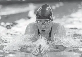  ?? NATHAN J. FISH/THE OKLAHOMAN ?? Norman North’s Jadie Brister competes in the 200-yard individual medley during the Class 6A West Regional at Edmond Public Schools Aquatic Center on Feb. 3.