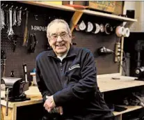  ?? STACEY WESCOTT/CHICAGO TRIBUNE ?? Ron Palacz, 91, senior package designer at Armour Packaging Technology, stands at his work bench Feb. 26 in Itasca.