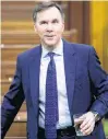  ?? REUTERS ?? Canada’s Minister of Finance Bill Morneau arrives to a meeting of the special committee on the COVID-19 pandemic, as efforts continue to help slow the spread of COVID-19, in the House of Commons on Parliament Hill in Ottawa on May 13.