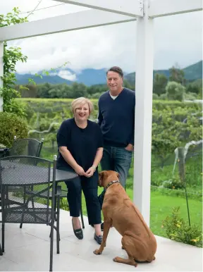  ??  ?? THIS PAGE (clockwise from top left) Hans and Therese with Samira the Rhodesian ridgeback. A bunch of cabernet sauvignon grapes, just one of the 28 varieties grown on the vineyard. This antique cabinet sits at the back entrance, it’s made from larch and...