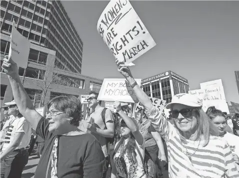  ?? COURTNEY SACCO, ( CORPUS CHRISTI) CALLER- TIMES, VIA USA TODAY NETWORK ?? Protesters march outside the Texas state Capitol in Austin. Similar marches were held in all 50 states and 32 countries Saturday.