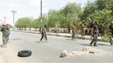  ?? PHOTO: Olatunji Omirin ?? Protesting policemen block Maiduguri- Kano highway over the alleged non- payment of their seven months allowances on Monday