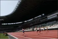  ?? SHUJI KAJIYAMA - THE ASSOCIATED PRESS ?? Japanese woman athletes compete during their 100 meter race at an athletics test event for the Tokyo 2020 Olympics Games at National Stadium in Tokyo, Sunday, May 9, 2021.