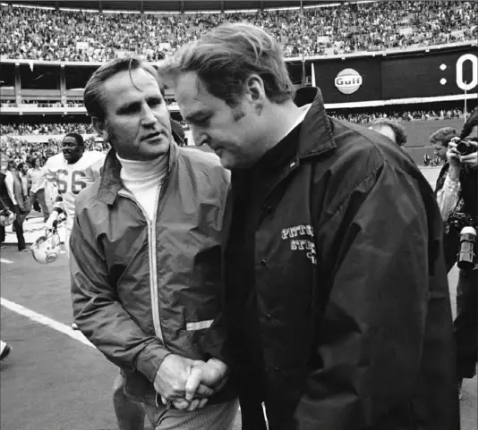  ?? Associated Press ?? Miami Dolphins coach Don Shula, left, shakes hands with Chuck Noll, coach of the Steelers, after a game in 1972. The pair were connected throughout their careers, including Shula helping Noll land with the Steelers. Shula died Monday at age 90. See Shula obituary, Page D-2.