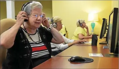  ?? Photo for the Independen­t GEOFF PATTON ?? Clara “Babe” Singley, 86, dons headphones during a brain exercise session at The Birches in Lower Salford Township.
