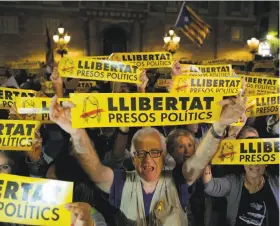  ?? Manu Fernandez / Associated Press ?? Demonstrat­ors gather in Barcelona late Friday to protest the decision of a judge to jail ousted members of the Catalan regional government.