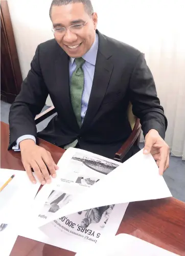  ?? PHOTOS BY NORMAN GRINDLEY/CHIEF PHOTO EDITOR ?? The Gleaner’s Guest Editor, Prime Minister Andrew Holness, enjoying his work in media.