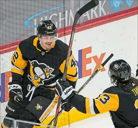  ?? Peter Diana/Post-Gazette photos ?? Kasperi Kapanen, left, celebrates the first of his two goals with Brandon Tanev Tuesday night at PPG Paints Arena.