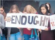  ?? MARLA BROSE/JOURNAL ?? La Cueva High School students gather for a moment of silence on Feb. 21, 2018, to remember victims from the Marjory Stoneman Douglas High School and Aztec High shootings.