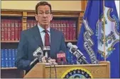  ?? JACK KRAMER — CT NEWS JUNKIE ?? Gov. Dannel P. Malloy speaks with reporters Friday at the state Capitol in Hartford.