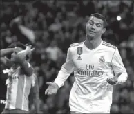  ?? JAVIER BARBANCHO / REUTERS ?? Cristiano Ronaldo reacts after following up his saved penalty to score Real Madrid’s winner in its 3-2 league victory over Malaga at Santiago Bernabeu in Madrid on Saturday.