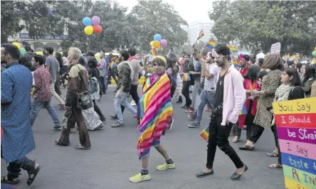  ??  ?? Activists on a gay pride parade in Delhi in November. Section 377 of the penal code bans homosexual intercours­e.