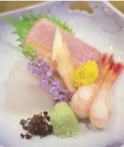  ??  ?? Assorted sashimi beautifull­y arranged by chef Edwin himself
