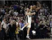  ?? ERIC GAY — THE ASSOCIATED PRESS ?? San Antonio Spurs’ Manu Ginobili (20) of Argentina blocks Houston Rockets’ James Harden three-point shot attempt in the final seconds of overtime of Game 5 in a secondroun­d NBA basketball playoff series, Tuesday in San Antonio. San Antonio won 110-107.