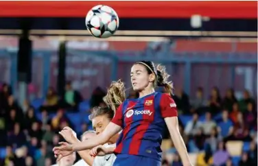  ?? File / Associated Press ?? ↑
Barcelona’s Aitana Bonmati heads the ball during the women’s Champions League quarterfin­als.