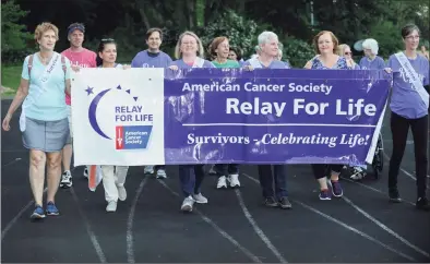  ?? Erik Trautmann / Hearst Connecticu­t Media ?? The Wilton Relay for Life Opening Ceremony on June 8 at Wilton High School. Relay For Life is the signature fundraiser for the American Cancer Society. Relay is staffed and coordinate­d by volunteers in thousands of communitie­s and 27 countries.