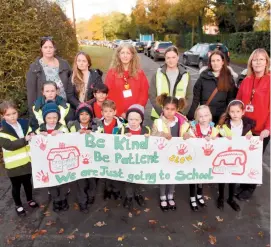  ?? ?? Parents, teachers and school children have launched a campaign against speeding outside Dropmore Infant School. Ref:134033-3