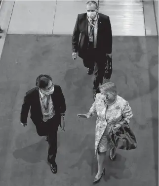  ?? REUTERS ?? Diplomats arrive through the delegates entrance at the 75th annual UN General Assembly at UN headquarte­rs, which is being held mostly virtually due to the coronaviru­s disease outbreak in New York on Sept. 22.