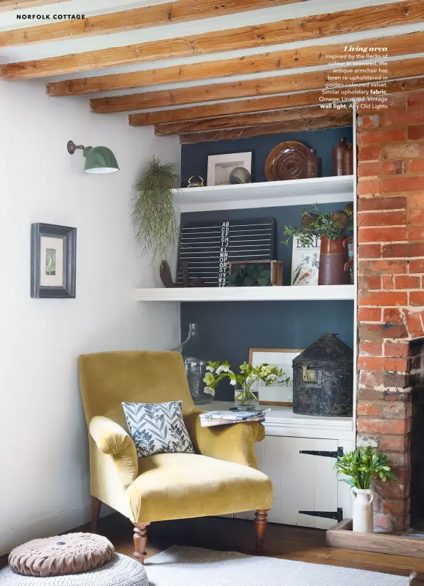  ??  ?? Living area Inspired by the flecks of colour in seaweed, the antique armchair has been re-upholstere­d in golden-coloured velvet. Similar upholstery fabric, Omega, Linwood. Vintage wall light, Any Old Lights