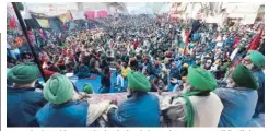  ??  ?? Farmer leaders address a gathering during their ongoing protest, at Delhi’s Tikri border, a day after the farmers’ tractor rally turned violent