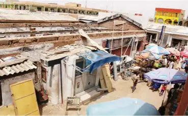  ??  ?? From Yusha’u A. Ibrahim, Ibrahim Musa Giginyu & Richard P. Ngbokai, Kano Section of the market destroyed by the fire Khadija Halilu