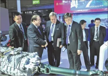  ?? PROVIDED TO CHINA DAILY ?? Axles displayed by Sinotruk at an auto show in Shanghai attract internatio­nal buyers.