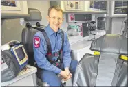  ?? CHRISTINE BOLAÑOS ?? Pflugervil­le Fire Department Chief Paramedic Richard Strohacker sits inside a reserve ambulance that will be used when the first ambulance is out of service, as is typical protocol for fire department­s.