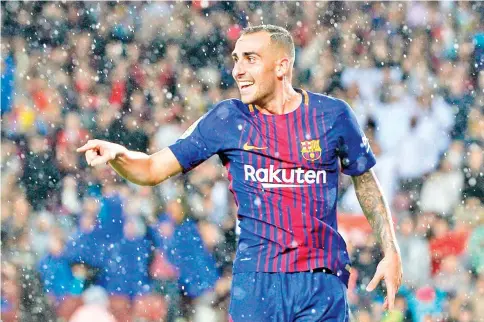  ?? — AFP photo ?? Barcelona’s Spanish forward Paco Alcacer celebrates after scoring a goal during the Spanish league football match FC Barcelona vs Sevilla FC at the Camp Nou stadium in Barcelona on November 4, 2017.