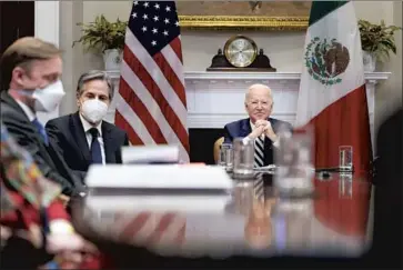  ?? Andrew Harnik Associated Press ?? PRESIDENT BIDEN, with, from left, White House national security advisor Jake Sullivan and Secretary of State Antony J. Blinken, met virtually Monday with Mexican President Andrés Manuel López Obrador.