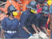  ??  ?? Women firefighte­rs pulling out people from the debris of Bhendi Bazaar’s 5-storey Hussaini building which collapsed in September 2017.