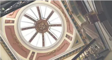  ??  ?? Interior features such as the dome above the staircase (left) and the ceiling and roof window in the council chamber have been restored