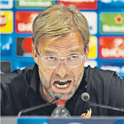  ??  ?? Balancing act: Jurgen Klopp does not want the pressure to stifle his team