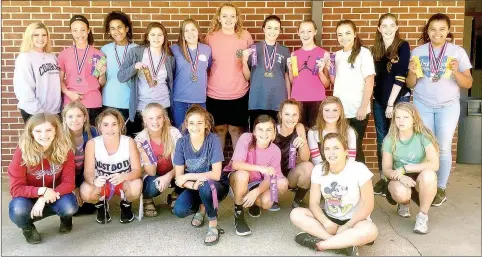  ?? SUBMITTED PHOTO ?? The Prairie Grove Junior High girls track and field team is swelling in numbers. Back row (from left): Jada Rowe, Trinity Dobbs, Jasmine Wynos, Gracie Pierce, Emily Traylor, Olivia Kestner, Alyssa LeDuc, Makayla Smith, Katie Doering, Jeryn Carter, Kyli Jenkins. Front row: Emma Hannah, Sophie Gaither, Charity Stearman, Toni Parrish, Addie Nall, Torie Price, Mariah Halbert, Abigail Howerton, Melanie Ward, and Jordan Ward. Not pictured: Jessica Burton, and Jacquelynn Jenkins. More kids are coming out. Coach Dana Froud is working with boys’ coach John Elder and Keith Bostain to develop competitiv­e athletes.