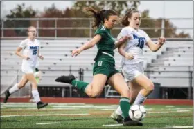  ?? JAMES BEAVER — FOR DIGITAL FIRST MEDIA ?? Dock Mennonite forward Peyton Scialanca (17) readies for a shot with MaST Charter defender Sarah Rooney (18) giving chase in the District 1-1A final Thursday.