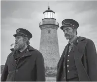  ?? A24 Films ?? ■ Willem Dafoe, left, and Robert Pattinson are shown in a scene from "The Lighthouse," available on Amazon Prime.