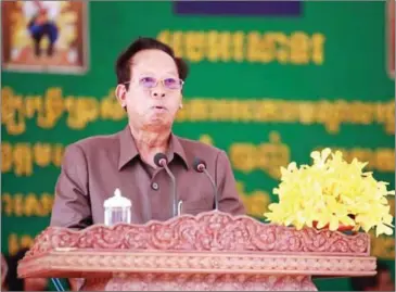  ?? AKP ?? Defence Minister Tea Banh speaks at an event in Siem Reap on Sunday where he threatened to use military force against the opposition party if they refuse to accept election results.