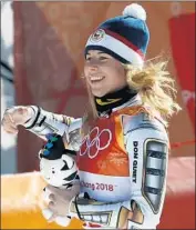  ?? Christophe Ena Associated Press ?? GOLD MEDALIST Ester Ledecka of the Czech Republic smiles after her triumph in the super-G.