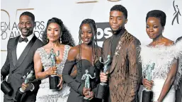  ?? FRAZER HARRISON/GETTY ?? Sterling K. Brown, from left, Angela Bassett, Lupita Nyong’o, Chadwick Boseman and Danai Gurira at the Screen Actors Guild Awards in 2019 in Los Angeles.