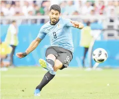  ?? - AFP photo ?? Uruguay’s forward Luis Suarez shoots during the Russia 2018 World Cup Group A football match between Uruguay and Saudi Arabia at the Rostov Arena in Rostov-On-Don on June 20, 2018.