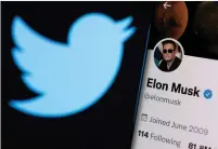  ?? (Dado Ruvic/Reuters) ?? ELON MUSK’S Twitter account is seen on a smartphone in front of the Twitter logo.