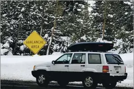  ?? PHOTOS BY SCOTT SONNER — THE ASSOCIATED PRESS FILE ?? Skiers leave the parking lot at Alpine Meadows ski resort in Alpine Meadows, where avalanche killed one skier and seriously injured another.